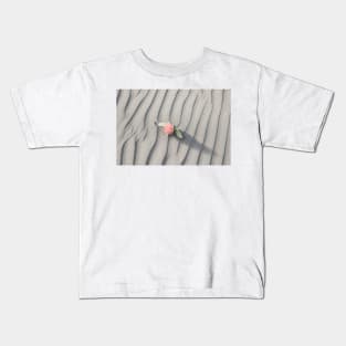 pohutukawa flower on grey wind rippled sand Kids T-Shirt